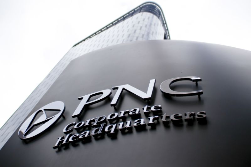 A sign for PNC Corporate Headquarters marks the block where the offices for the banking corporation are in downtown Pittsburgh on Monday, Oct. 16, 2017, in Pittsburgh. (AP Photo/Keith Srakocic)